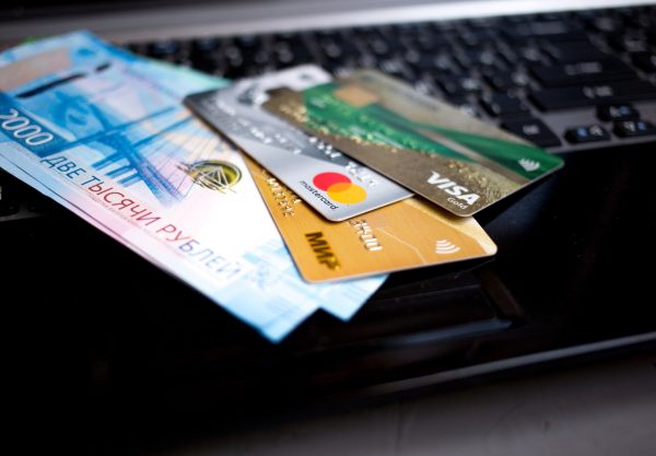 MOSCOW, RUSSIA - 08 28 2018: banknotes Russian rubles and credit cards are on the laptop keyboard